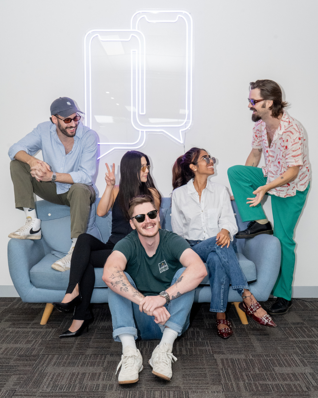 Five Social Status team members together in their Melbourne office
